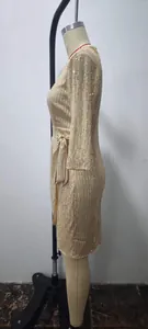 Side view of elegant champagne gold sequin long dress showing shimmering texture