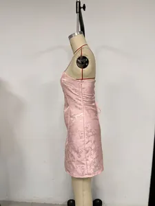 Side view of elegant pink floral jacquard bodycon mini dress displayed on a studio mannequin.