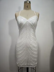 Detail of white sequined bodycon dress with V-neck and spaghetti straps on mannequin
