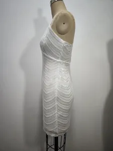 Side view of white sequined bodycon dress showing elegant chevron pattern details