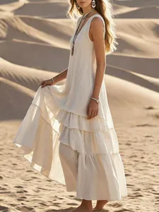 Bohemian white cotton linen tiered sleeveless maxi dress in a golden desert setting