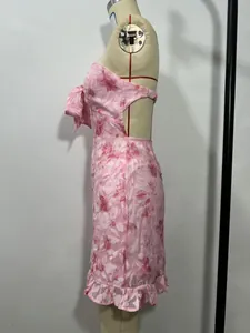 Detailed side view of a sexy pink floral strapless mini dress with back cut-out.
