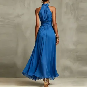 Back view of a vibrant blue halter neck chiffon maxi dress with pleated waist detail