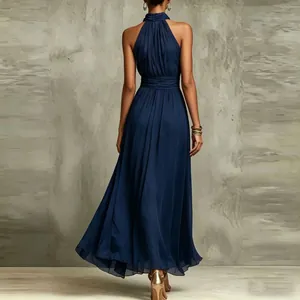 Back view of an elegant navy blue halter neck chiffon maxi dress with pleated details