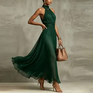 Elegant emerald green halter chiffon maxi dress with pleated waist and flowy skirt