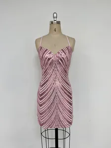 Elegant pink sequin bodycon dress with chic chevron pattern shown on a studio mannequin
