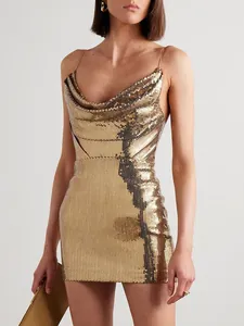 Close-up of gold sequin cowl neck mini dress with delicate straps