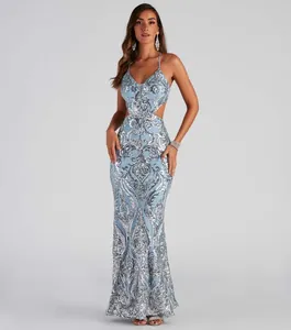 Detailed view of an elegant light blue sequined floor-length gown with side cut-outs