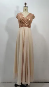 Detail of V-neck evening dress featuring sequined rose gold bodice and chiffon skirt