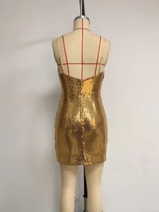 Detail view showing the shimmering gold sequin texture of a bodycon backless mini dress
