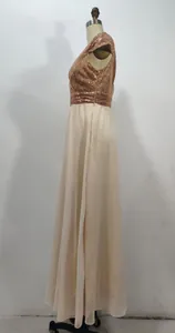 Detailed side view of V-neck rose gold sequin and chiffon evening gown on mannequin.