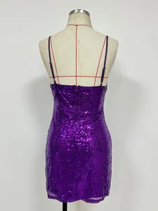 Back view of a purple sequined mini bodycon dress on a mannequin with spaghetti straps.