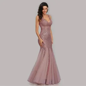 Detailed side view of elegant pink sequined mermaid evening gown with a deep V-neckline.