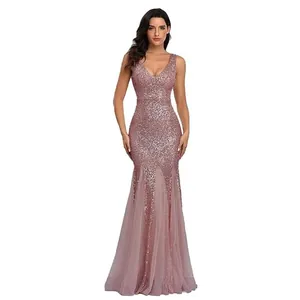 Close-up of the rose gold sequin texture and tulle mermaid hem of the evening gown