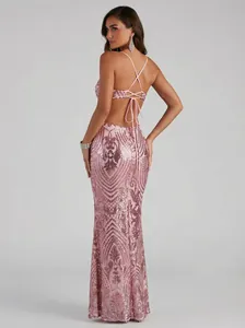 Back view of elegant pink sequined evening gown with criss-cross spaghetti straps