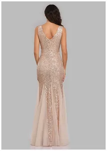 Elegant back view of a rose gold sequined mermaid evening gown with tulle inserts