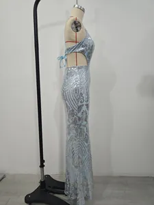 Side profile of light blue sequin evening gown on mannequin for formal parties.
