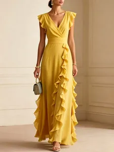 Full-length view of a yellow V-neck chiffon gown with ruffles and pleats detail