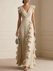 Elegant cream chiffon maxi dress featuring layered ruffled details and a sophisticated V-neck