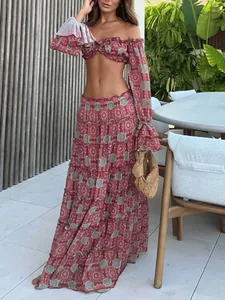 Two-piece bohemian set featuring a ruffled crop top and a tiered mandala print maxi skirt