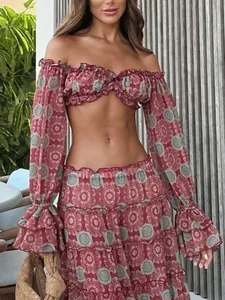Close-up of bohemian mandala print on ruffled off-shoulder top and tiered maxi skirt set