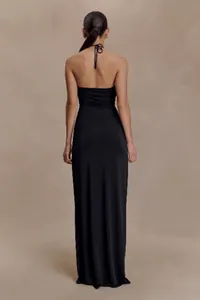Detailed back view of an elegant slim fit black halter neck long dress with tie