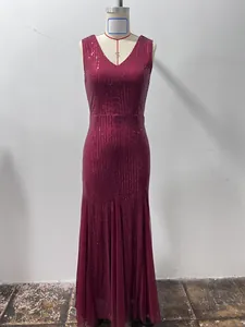 Detail of a sparkling red sequin evening gown with an elegant fishtail silhouette
