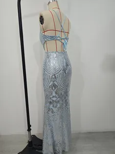 Detailed side view of elegant light blue sequin evening gown with sexy open back design