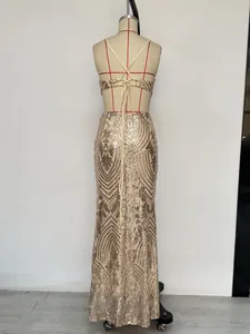 Detail view of champagne gold sequined evening dress featuring a back lace-up design