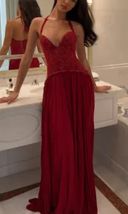 Elegant red halter neck lace pleated maxi dress with backless design for evening events