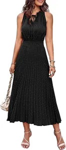 Detailed view of women's black Swiss dot sleeveless pleated A-line dress with ruffled neck