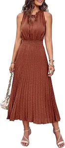 Elegant sleeveless Swiss dot pleated midi dress with tie-neck detail in terracotta.