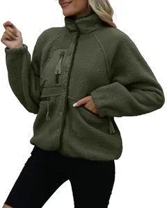 Detailed view of women's green sherpa fleece jacket with standing collar and pocket