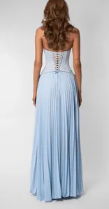 Detailed view of the light blue pleated maxi dress with elegant lace-up back design