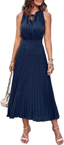 Detail view of navy blue sleeveless midi dress with Swiss dot and pleated design