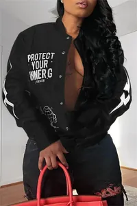 Close-up of black bomber jacket featuring white 'Protect Your Inner G' graphic print