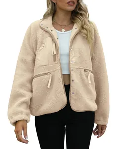 Close-up view of women's beige sherpa fleece jacket with button and zip pockets