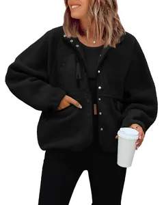 Front view of a black women's polar fleece jacket with buttons and chest pocket