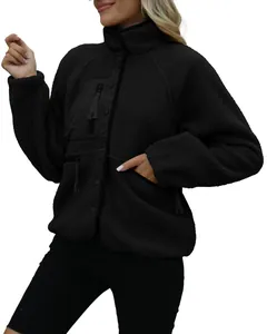 Detailed view of women's black textured fleece jacket with utility chest pocket detail