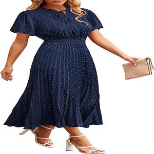Elegant navy blue Swiss dot midi dress featuring a pleated skirt and a tie V-neck detail.