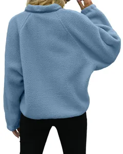 Back view of a blue polar fleece sweatshirt with textured sherpa material for women