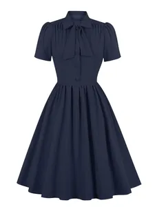Front view of a navy blue vintage tie-neck A-line swing dress for women