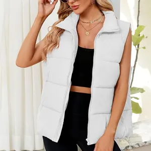 Close-up view of a stylish white puffer vest with stand collar on a female model