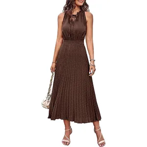 Elegant brown sleeveless Swiss dot midi dress with pleated A-line skirt and V-neck tie