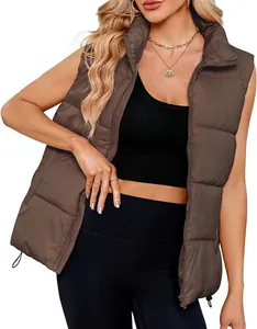 Detail view of a women's brown quilted puffer vest with a stylish stand-up collar jacket