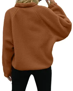 Detailed back view of a women's brown fuzzy sherpa fleece jacket with a soft textured finish