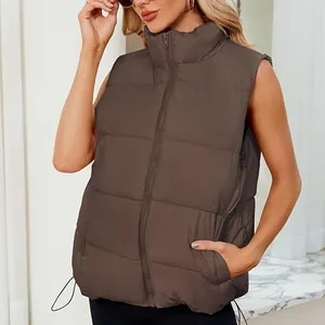Close-up view of a women's brown quilted puffer vest featuring a stand collar design