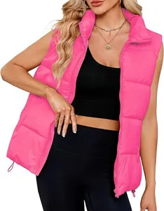 Detailed view of women's bright pink padded puffer vest with stand-up collar