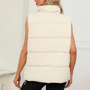 Detail of the back view of a beige women's sleeveless puffer vest with high stand collar.