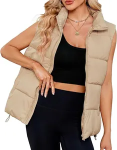 Close-up detail of a women's khaki quilted puffer vest with a stand collar and zipper.